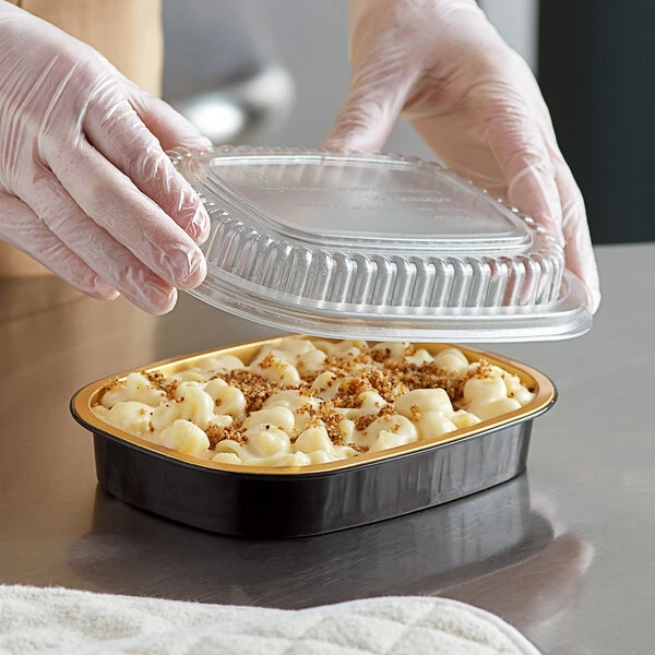 Choice Heavy Duty Smoothwall Black and Gold Small Oblong Foil Take-Out Pan with Dome Lid 23.3 oz. - 100/Case