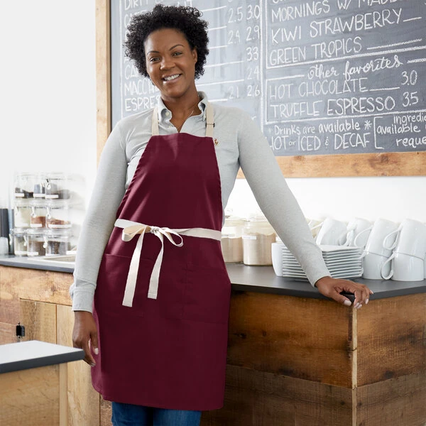Choice Burgundy Poly-Cotton Adjustable Bib Apron with 2 Pockets and Natural Webbing Accents - 32" x 30"