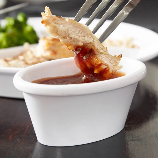 Carlisle S31402 4 oz. White Melamine Oval Ramekin - 48/Case