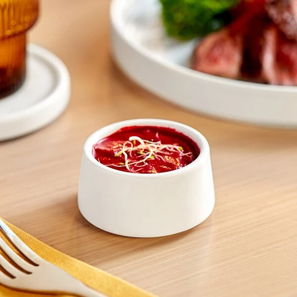 Acopa Lore 1.5 oz. Bright White Porcelain Sauce Cup - 12/Case