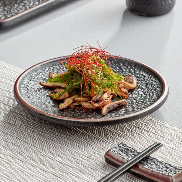 Acopa Heika 6" Black Matte Textured Coupe Stoneware Plate - 12/Case