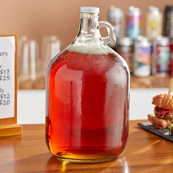 Acopa 128 oz. Customizable Clear Growler with Cap - 4/Case