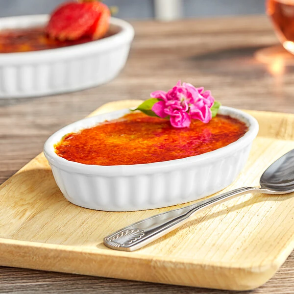 Acopa 5 oz. Oval Bright White Fluted Porcelain Souffle / Creme Brulee Dish - 36/Case