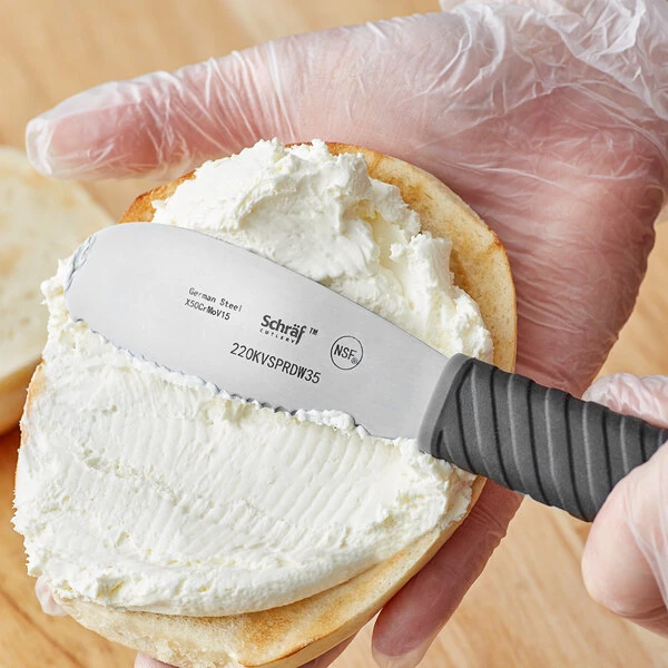 Schraf 3 1/2" Scalloped Stainless Steel Sandwich Spreader with TPRgrip Handle