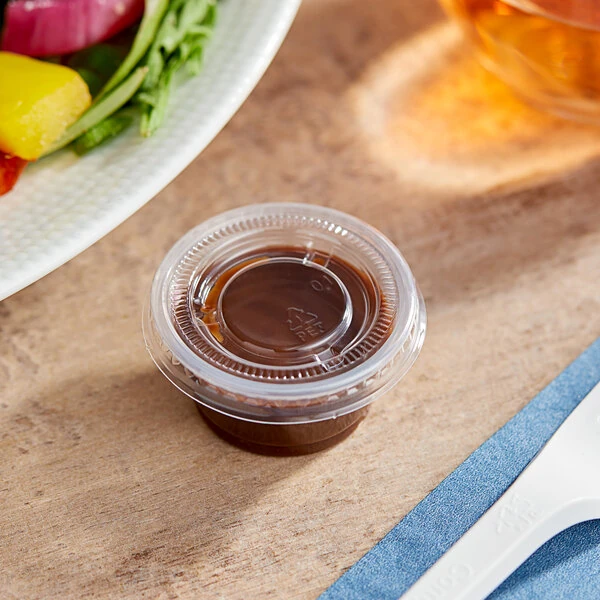 Choice 0.75 oz. Clear Plastic Souffle Cup / Portion Cup with PET Plastic Lid - 100/Case