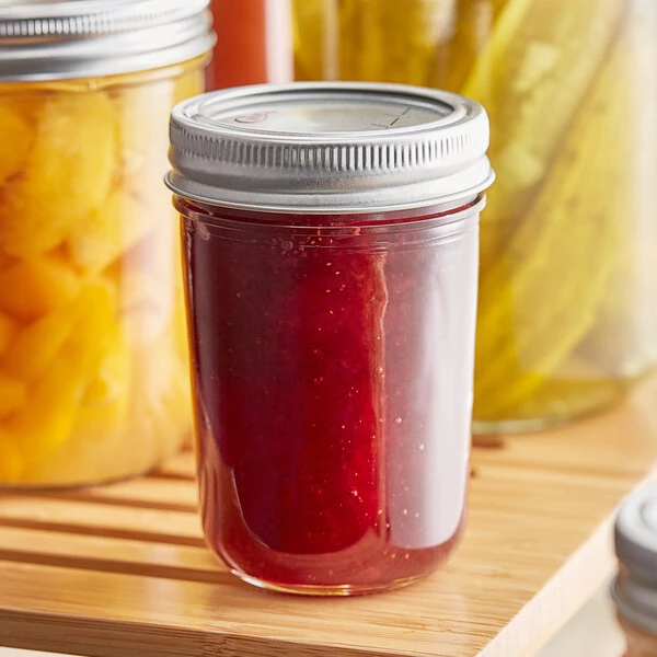 Choice 8 oz. Half-Pint Regular Mouth Glass Canning / Mason Jar with Silver Metal Lid and Band - 12/Case