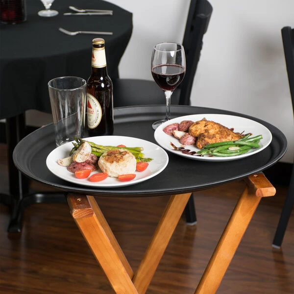Cambro 2500CT110 Camtread® 19" x 23" Black Non-Skid Oval Serving Tray - 6/Case