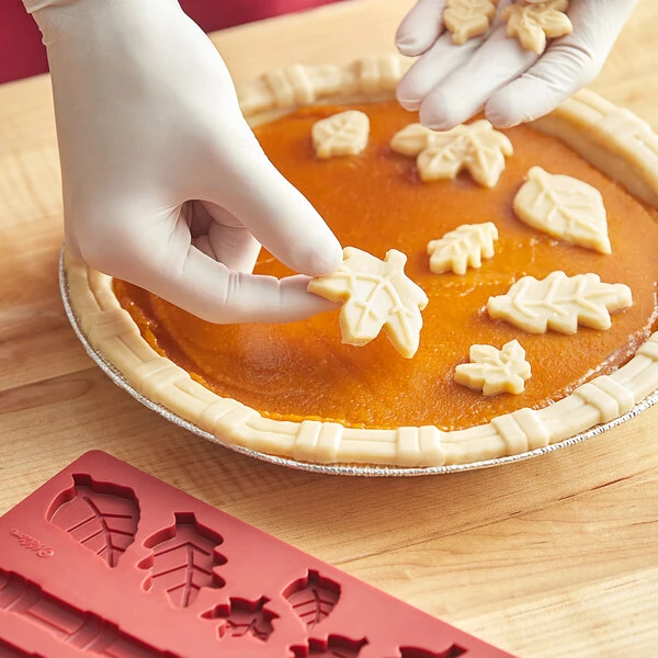Wilton 10 1/2 inch x 5 1/4 inch 8-Compartment Decorative Autumn Pie Crust Silicone Mold 191010228