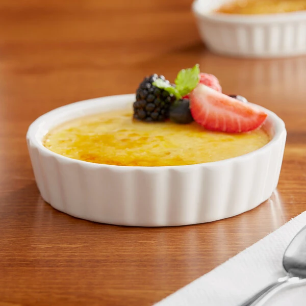 Acopa 8 oz. Round Ivory Fluted Porcelain Souffle / Creme Brulee Dish - 36/Case