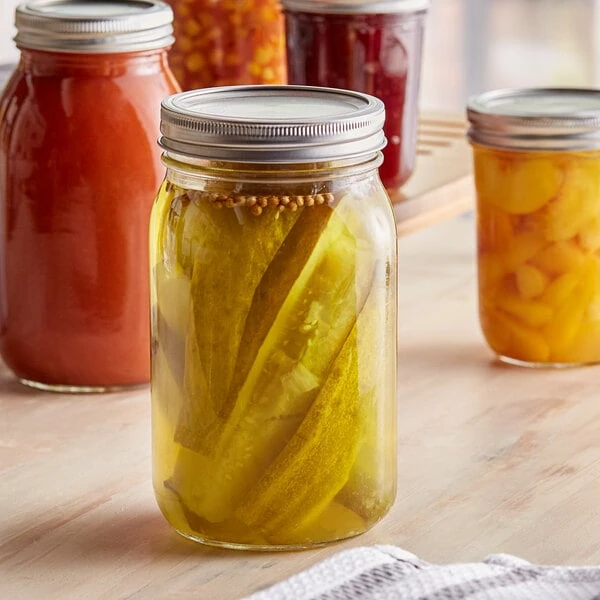 Choice 32 oz. Quart Wide Mouth Glass Canning / Mason Jar with Silver Metal Lid and Band - 12/Case
