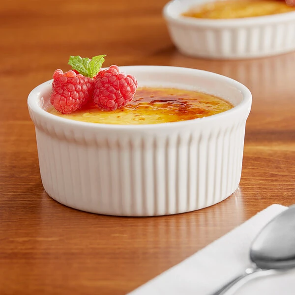 Acopa 10 oz. Round Ivory Fluted Porcelain Souffle / Creme Brulee Dish - 24/Case