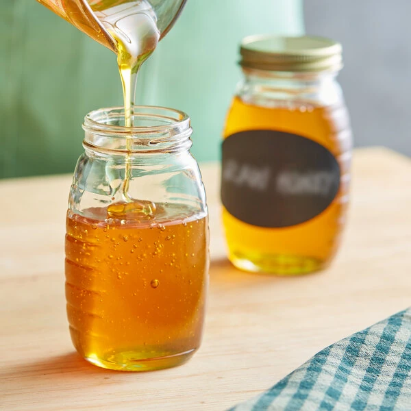 5.5 oz. (8 oz. Honey Weight) Classic Queenline Glass Honey Jar - 24/Case
