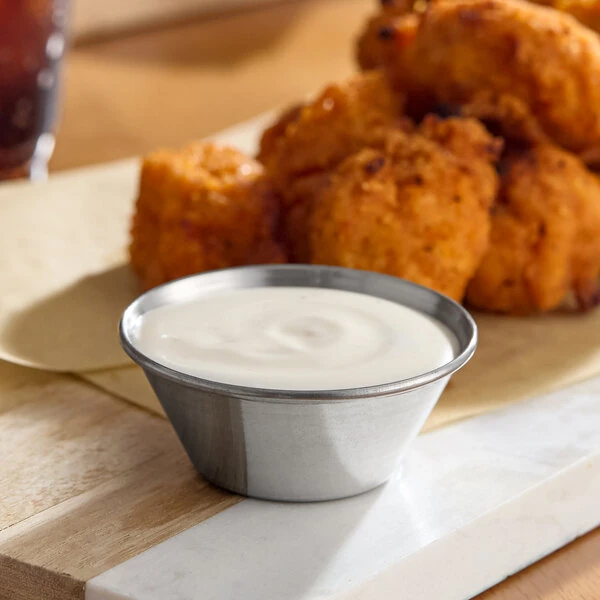Choice 1.5 oz. Smooth Stainless Steel Round Sauce Cup - 12/Pack