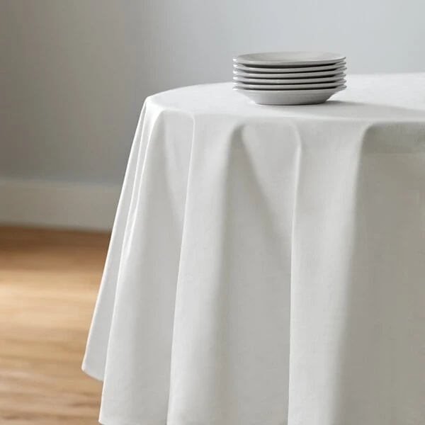 Intedge 83" Round White Seamed 50/50 Poly Cotton Blend Hemmed Tablecloth