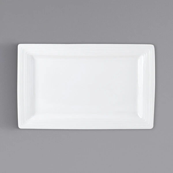 Tuxton FPH-110B Pacifica 11" x 6 7/8" Bright White Embossed Wide Rim Rectangular China Plate - 12/Case